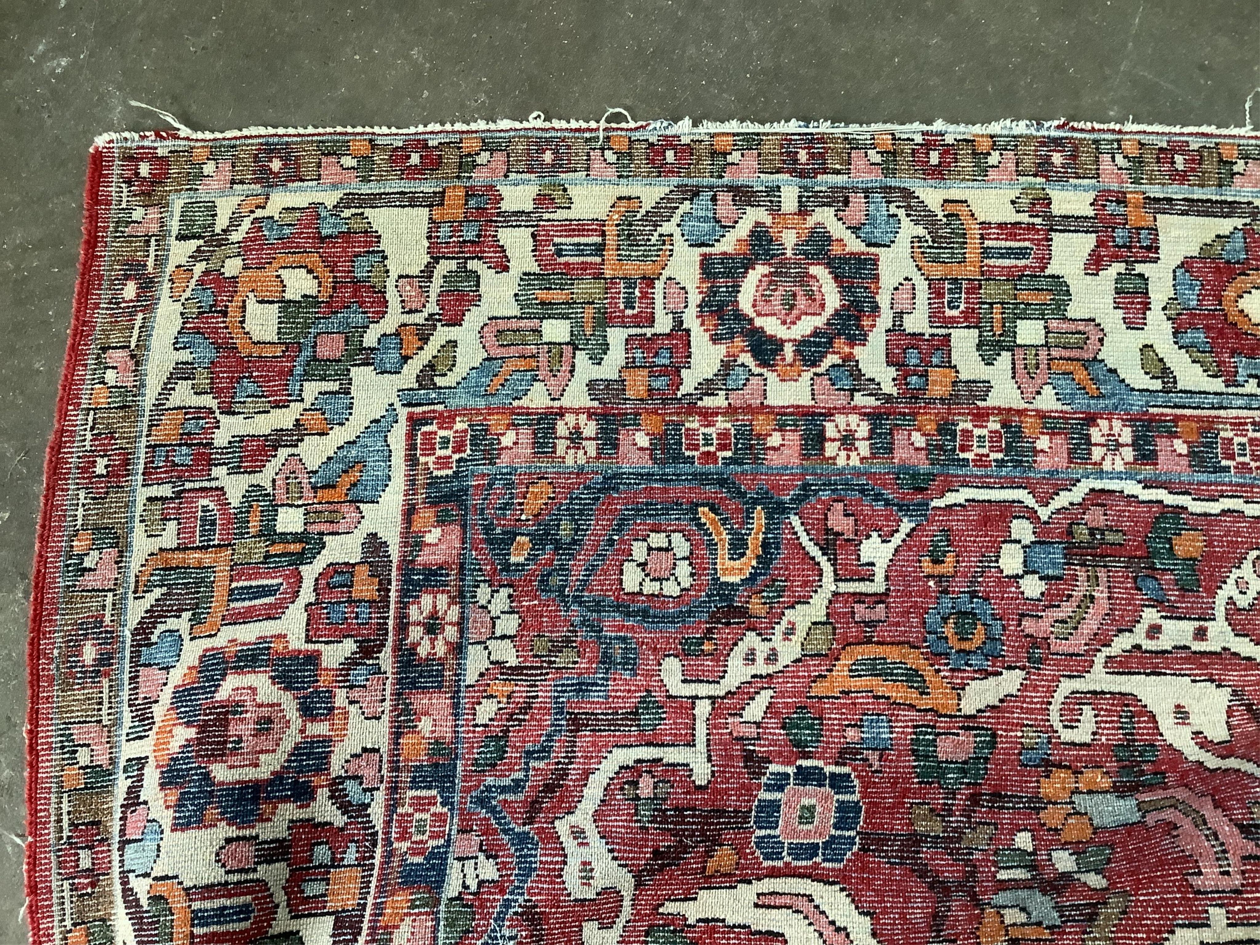 A North West Persian brick red ground rug, 200 x 148cm. Condition - fair